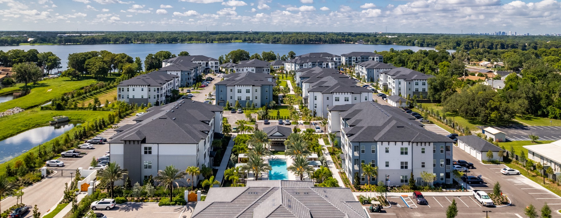 aerial view of the community with the lake behind it