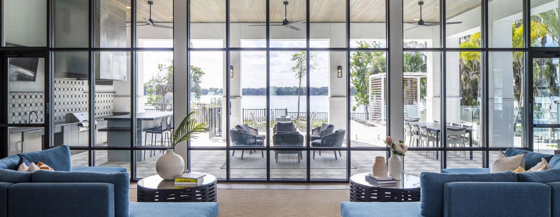 a room with a large window with a view of a patio